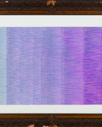 Photograph of an artwork consisting of multiple columns of textured shades of slightly shifting hues, from light cyan on the left to royal purple on the right. The artwork has a white, matte border and a dark brown, highly ornate frame.