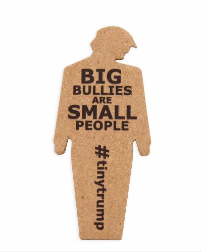 Close up of a tiny trump with the slogan \"Big Bullies Are Small People\"