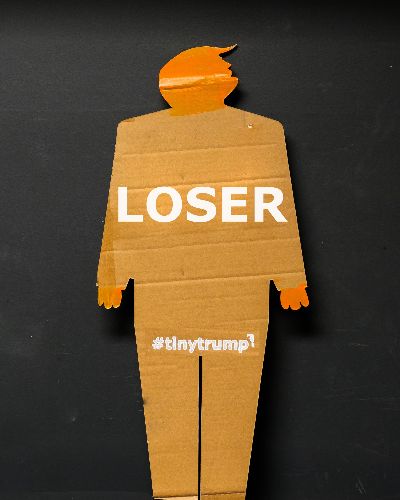 Same as previous image except the slogan is Loser.