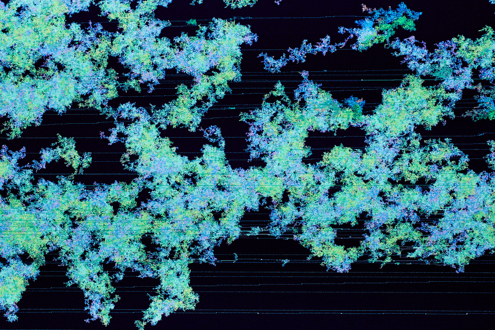 Close-up photograph of the above artwork showing a blooming mass of teal, turquoise, and bluish/purplish pixel clusters, with digital barbed wire&mdash;looking strands running across the surface of the image from left to right.