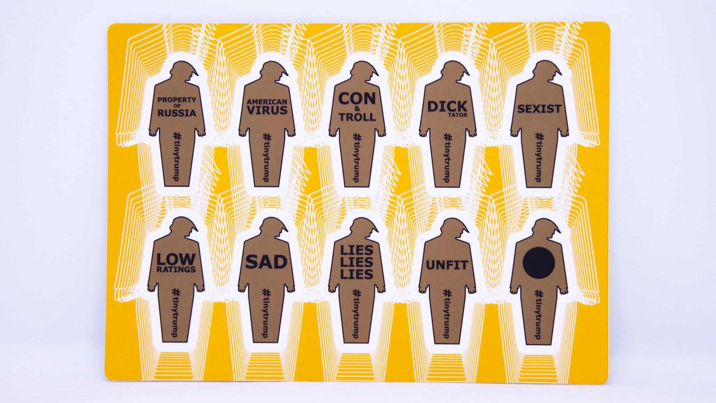 Product photograph of a 4 inch by 6 inch sticker sheet consisting of a yellow background and 12 individual tiny trumps with the following slogans: Giant Narcissist, Enemy of the People, All money no heart, Cold as I.C.E, Racist, Fake News, Draft Dodger, Cry Baby, Epic Failure, Impeached