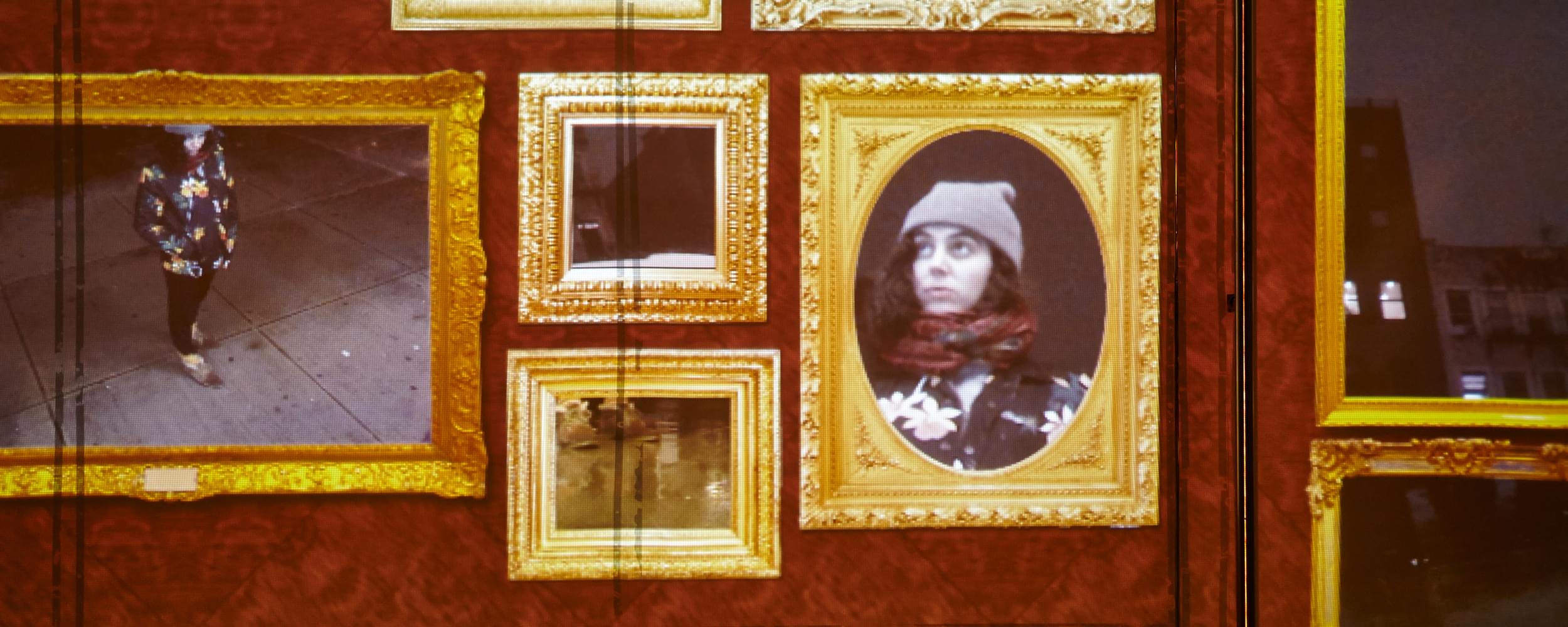 Close up photograph showing a projected image of about 10 ornately decorated golden frames, Baroque style, where the contents of each frame is a slice of the external environment. For example, in the leftmost bottom frame shows a video of a person on the sidewalk from a top down view, the leftmost upper frame shows a closeup of that person's sneakers, while a few frames over to the right shows a close up of that viewer's face. The other 7 frames show different slices of the urban environment in which the viewer is in (apartment building windows in the background, a bus tire that's passing by on the street, etc.